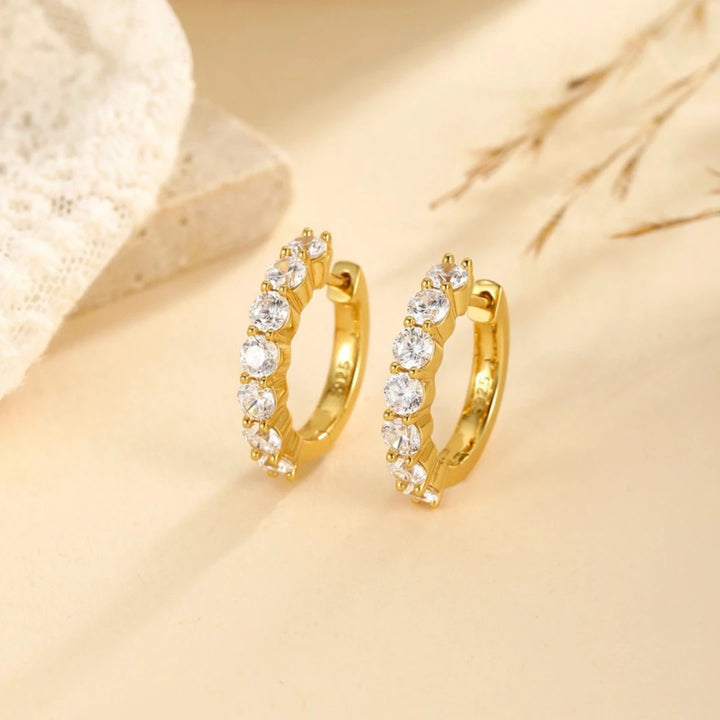 Moissanite huggie hoop earrings, Gold Plated, styled photo