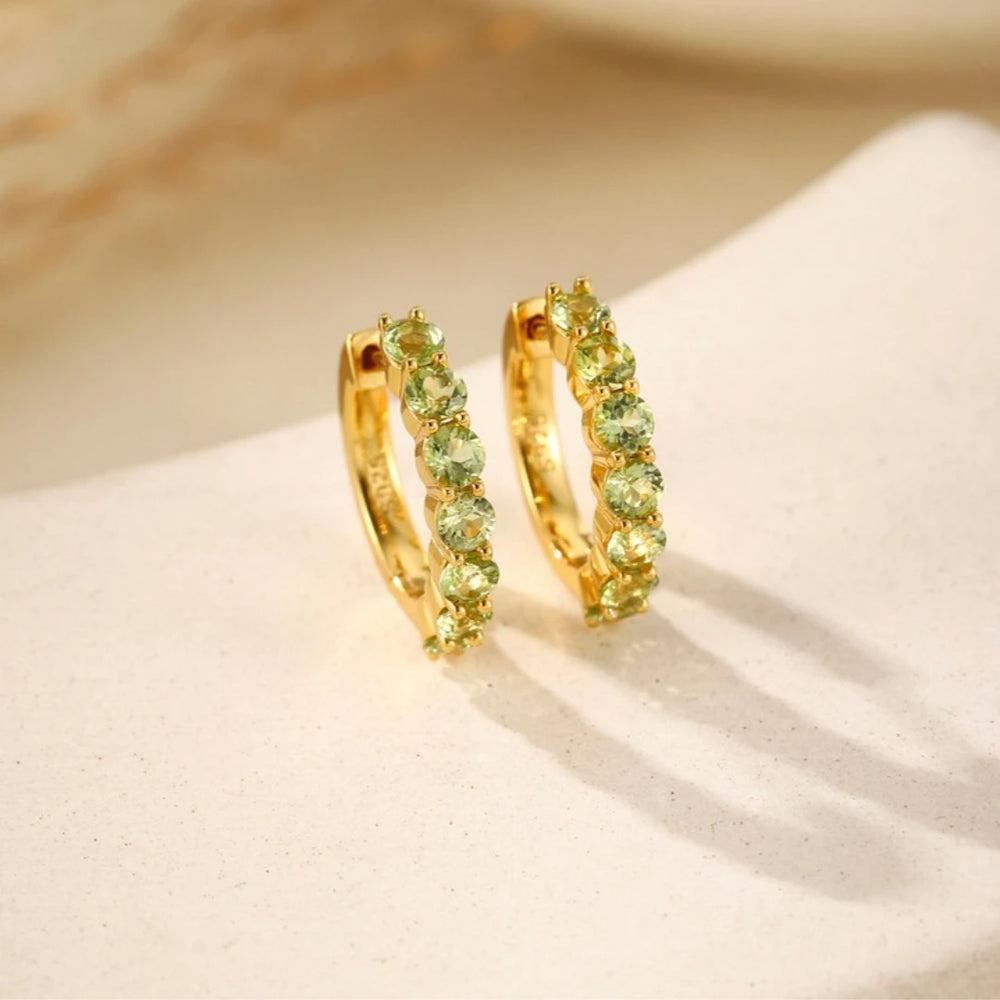 Peridot huggie hoop earrings, Gold Plated, styled photo