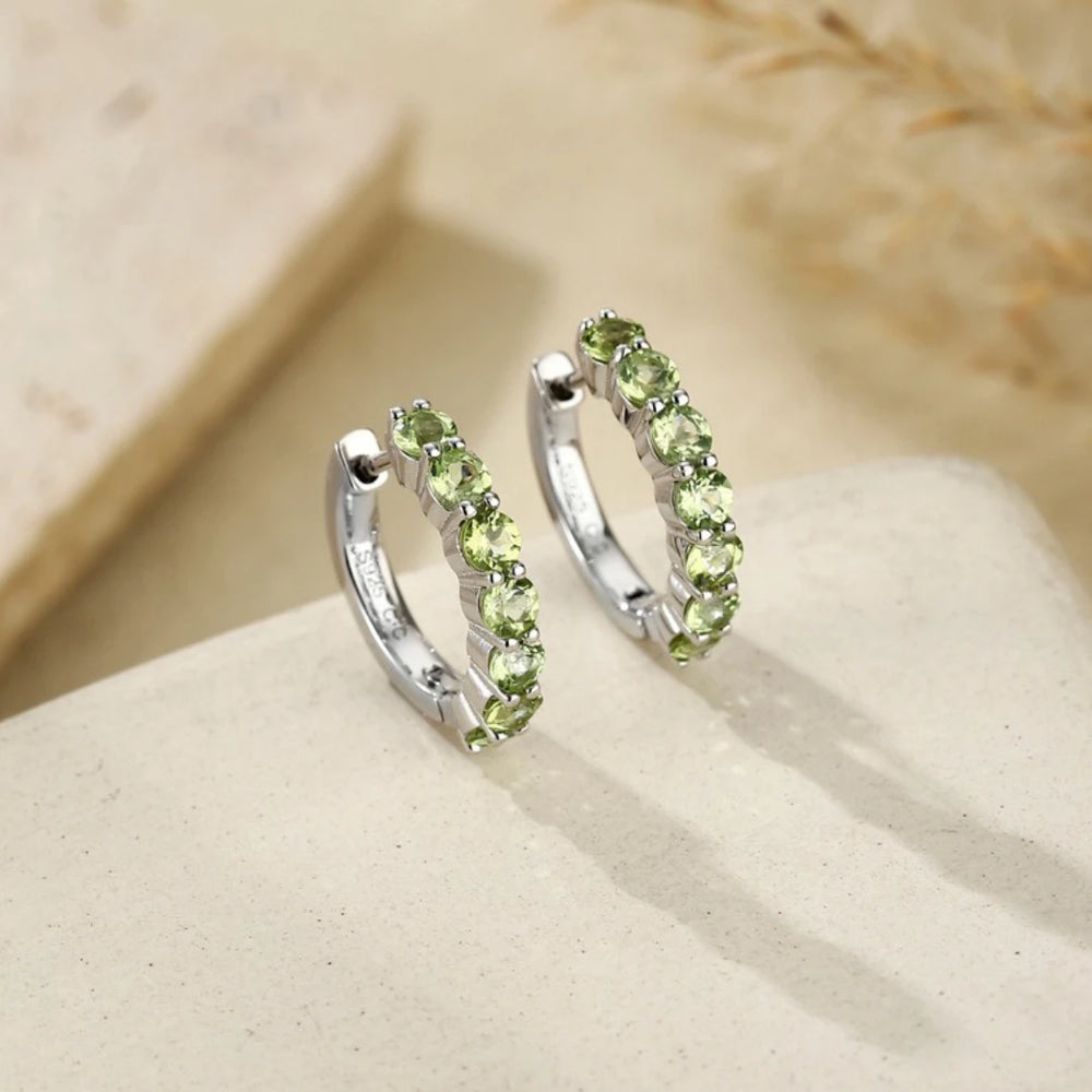 Peridot huggie hoop earrings, Sterling Silver, styled photo