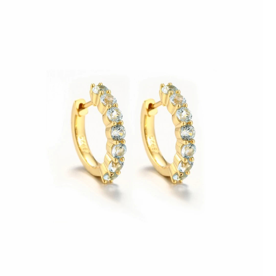 Blue Topaz huggie hoop earrings, Gold Plated, on white background