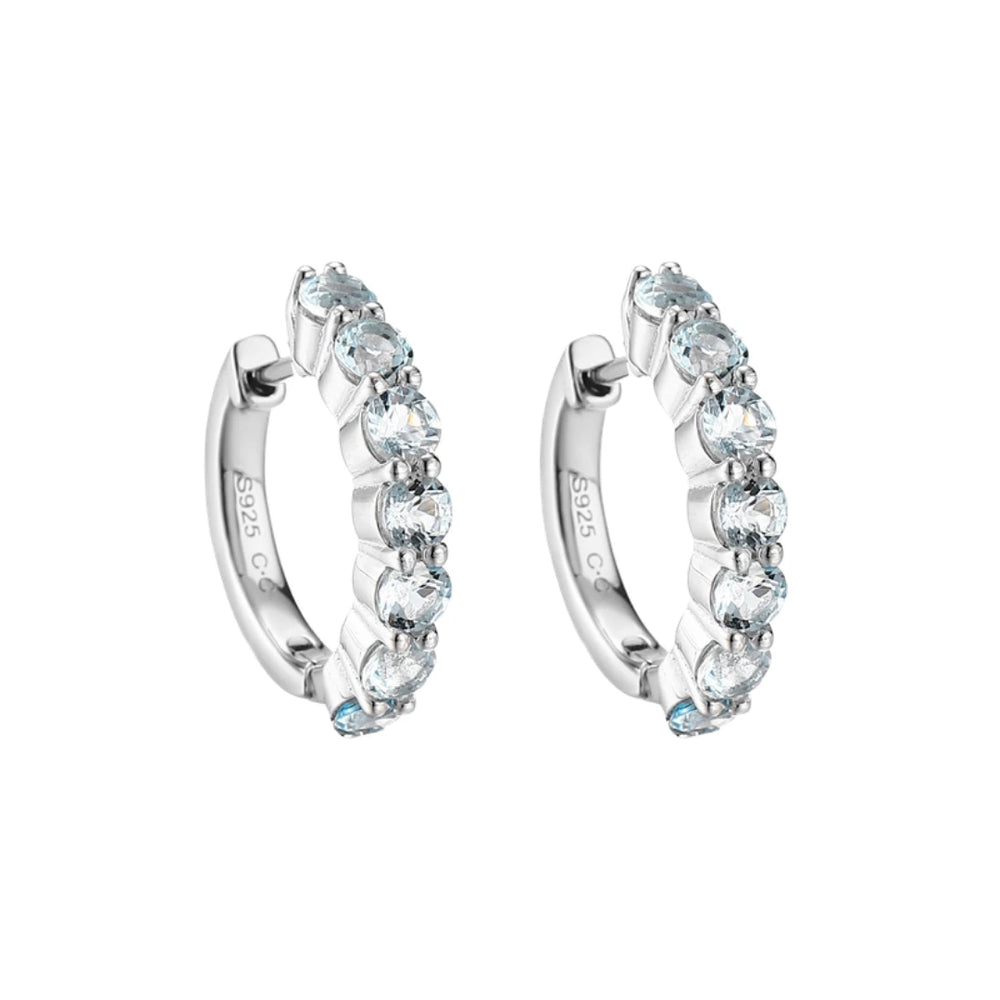 Blue Topaz huggie hoop earrings, Sterling Silver, on white background